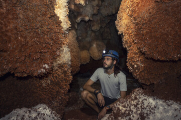 Young tourist in a miner helmet in the large Bellamar caves (Cuevas de Bellamar), Cuba