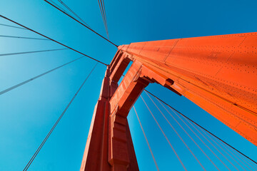 Low angle shot of the Golden Gate Bridge against the blue sky, San Fransico, California, USA