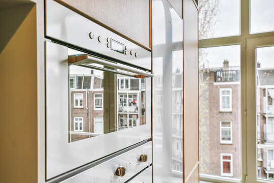 Oven close-up with street reflections