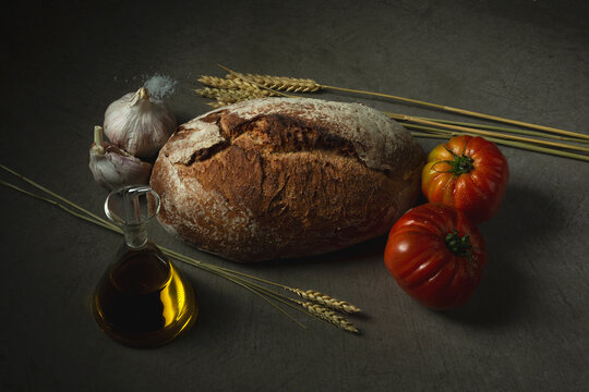 Bread near tomatoes and garlic