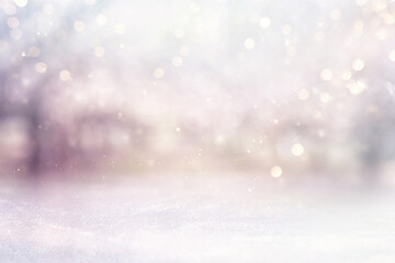 blurred abstract photo of light burst among trees and glitter bokeh lights