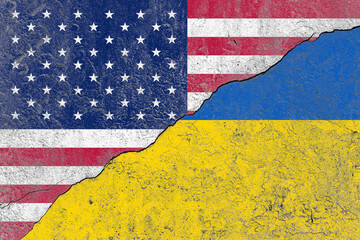United states and ukraine flag on a cracked old concrete wall