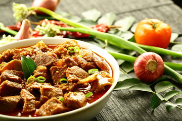 Bowl of homemade traditional Indian mutton curry roast with  tender lamb meat.