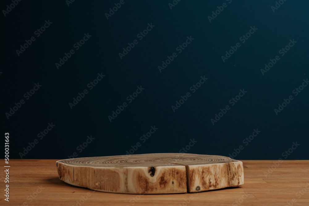Poster closeup shot of a cut tree log on a tree with a dark blue background