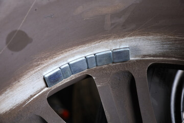 Balancing lead mounted on car wheel