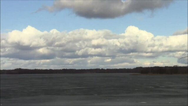 Timelapse- the movement of clouds over the ice of the lake in spring