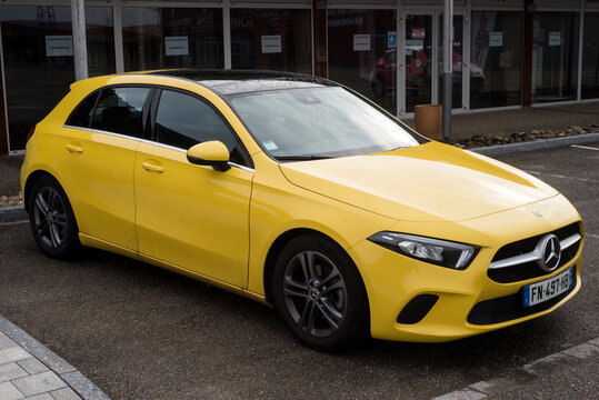 Lutterbach - France - 3 April 2022 - Front view of yellow Mercedes A45 cars parked in the street