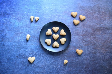 Fototapeta na wymiar Crunchy fresh baked heart shape cookie