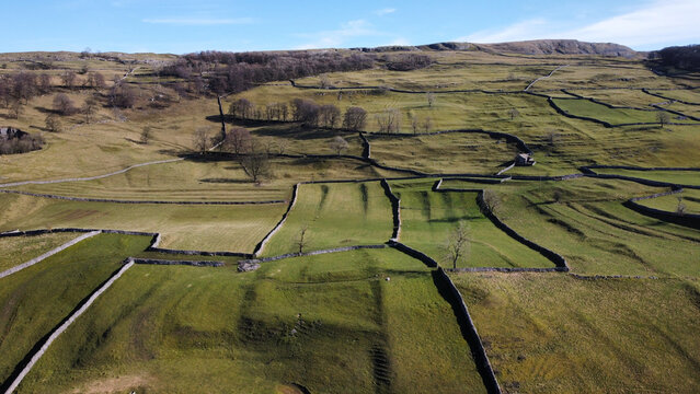 Aerial shot of greenery field contours between Stainforth and Langcliffe