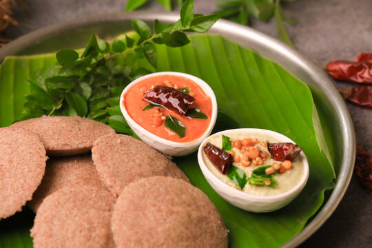 raagi idly served in a banana leaf with chutneys ,south indian famous breakfast idly