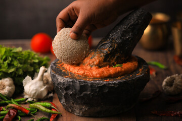 chutney grinding in mortar and pestle,south indian food