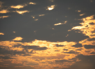 Evening clouds contrast with the sunlight and the beautiful sky scenery.