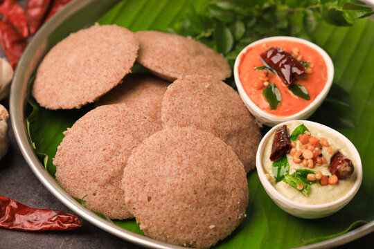 raagi idly served in a banana leaf with chutneys ,south indian famous breakfast idly