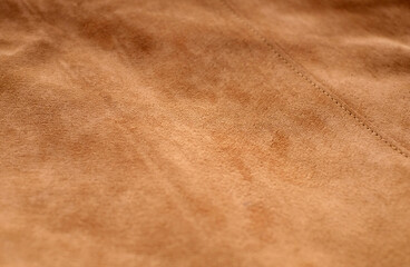 Suede leather beige matte background, texture of seamless sand leather