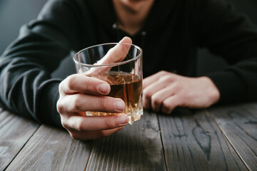 businessmen holding a glass of whiskey