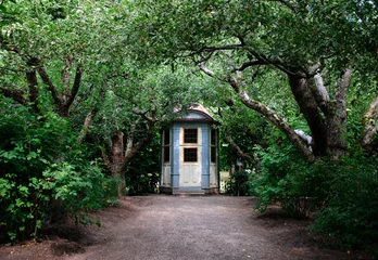 Foto op Canvas A small house in a garden in Stockholm Sweden © Johan Van Beusekom/Wirestock Creators