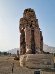 Colossi of Memnon, massive stone statue of the Pharaoh Amenhotep III, in the Valley of Kings in Luxor, Egypt.