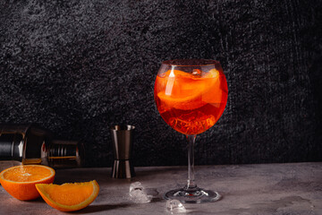 Glass of cold Aperol spritz cocktail.