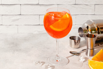 Glass of cold Aperol spritz cocktail.