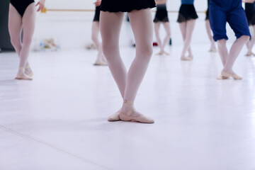 Fototapeta premium Close up of classic ballet dancers feet's dancing during a lesson