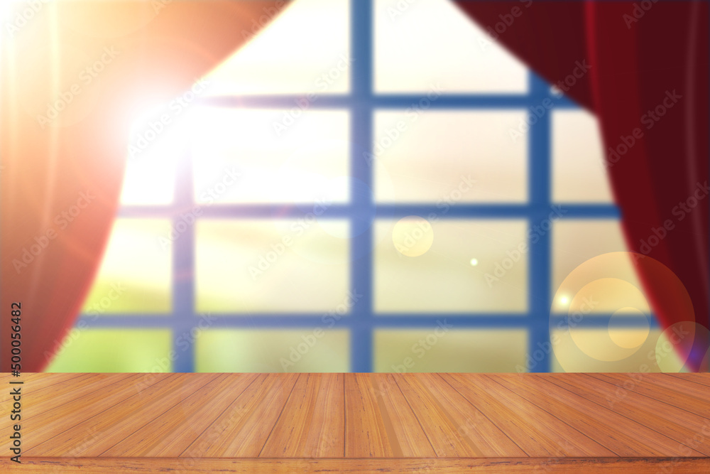 Poster empty wooden table in front of open red screen in the background of a closed window with sunlight.