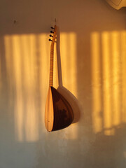 Musical instrument on the wall by the sunset