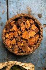 Closeup of wood chunks inside the basket on table
