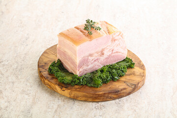 Cut of pork bacon over board