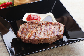 Grilled rib-eye steak beef meat