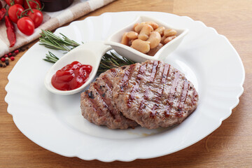 Grilled beef burger cutlet with sauce