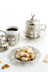 Roasted Pistachio Nuts Served with Turkish Tea or Coffee, on WHite Background