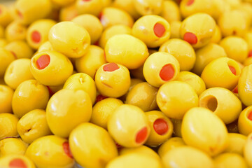 green organic and red pepper in brine and olive varieties