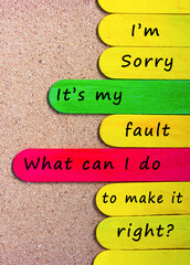 Motivational and inspirational quote on colorful wooden stick.