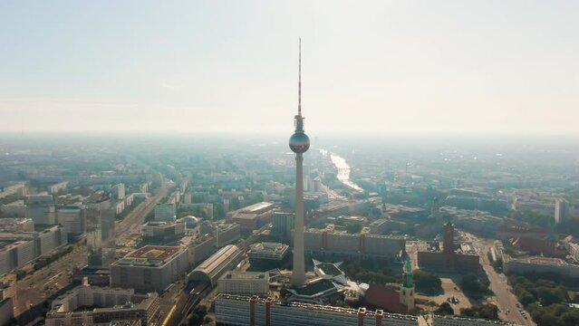 Wide Aerial Panoramic View of Berlin Cityscape with TV Tower - Berliner Fernsehturm - on Alexanderplatz in Capital of Germany. Scenic Skyline with Landmarks. 4K establishing drone shot