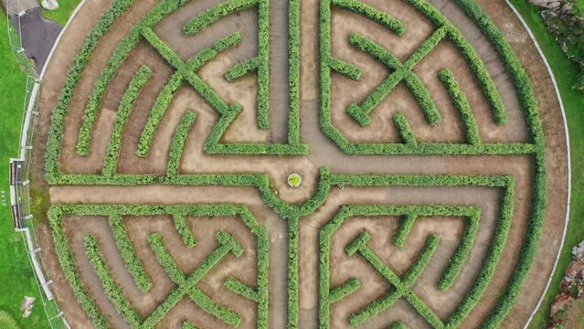 High angle aerial vertical view of a garden labyrinth made of perfect cut bushes