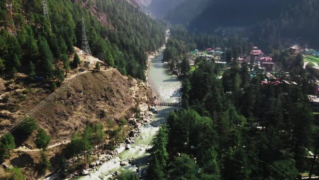 Aerial view of Himachal Pradesh Parvati Valley river, drone reveal Himalayan mountains landscape with snow peak unpolluted Indian natural vegetation