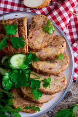 Chicken roll with cheese and vegetables sliced, on a wooden board.rustic style.selective focus