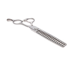 Scissors for cutting people and pets. Grooming scissors. Closed scissors on a white isolated background. Angle view.