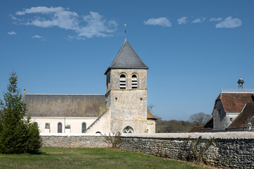 Fototapeta na wymiar View of the church Saint Vincent of Chemillé-sur-Indrois on a sunny afternoon