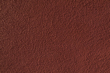 Red wall with grained texture. Grunge background.