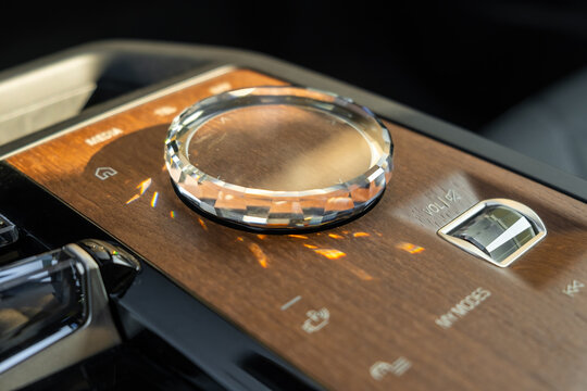PRAGUE , CZECH REPUBLIC - MARCH 10 2022: Close up multimedia system control in luxury car BMW IX. 