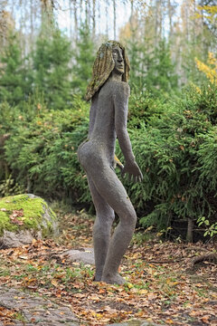 Parikkala, Finland. Sculpture of a naked man by artist Veijo Ronkkonen in his sculpture park (Parikkalan patsaspuisto). The park contains about 560 statues and a magnificent garden.