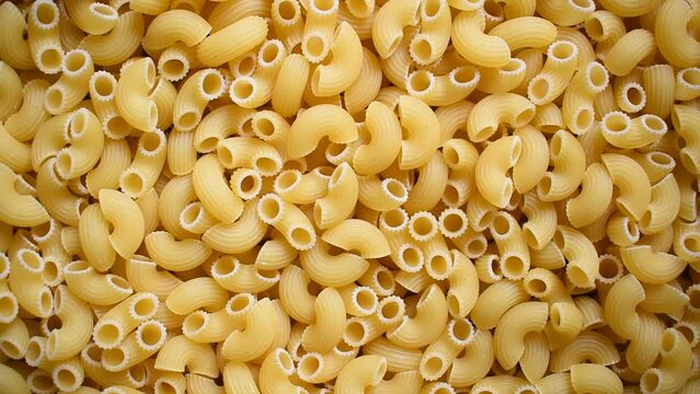 Raw whole dried ridged elbow macaroni pasta
