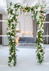 Arch decorated with artificial flowers. High quality photo