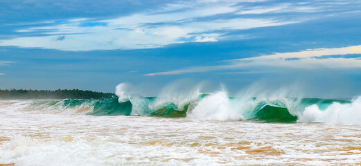 Tropical beach, azure ocean and blue sky. Wide photo.