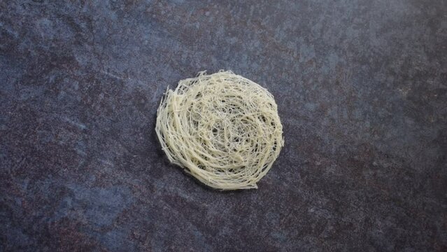 Raw whole dried round string hopper rice noodles