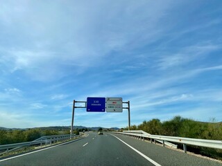 Spanish highway in Castile La Mancha with road sign indicating way to Albacete.