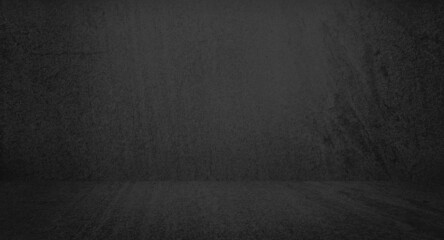 dark black slate empty room with light from above used for background and display your product. vintage distressed smooth texture and dark gray charcoal color paint.