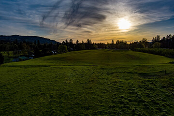 Fototapeta premium Sunset over a peaceful meadow