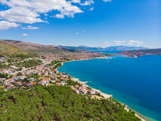 Naklejka na ściany i meble Croatia. Summer. Tourist season. Sunny day. Coast of the Adriatic Sea. Small town by the sea. Drone. Aerial view